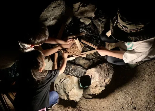 Kids building the campfire